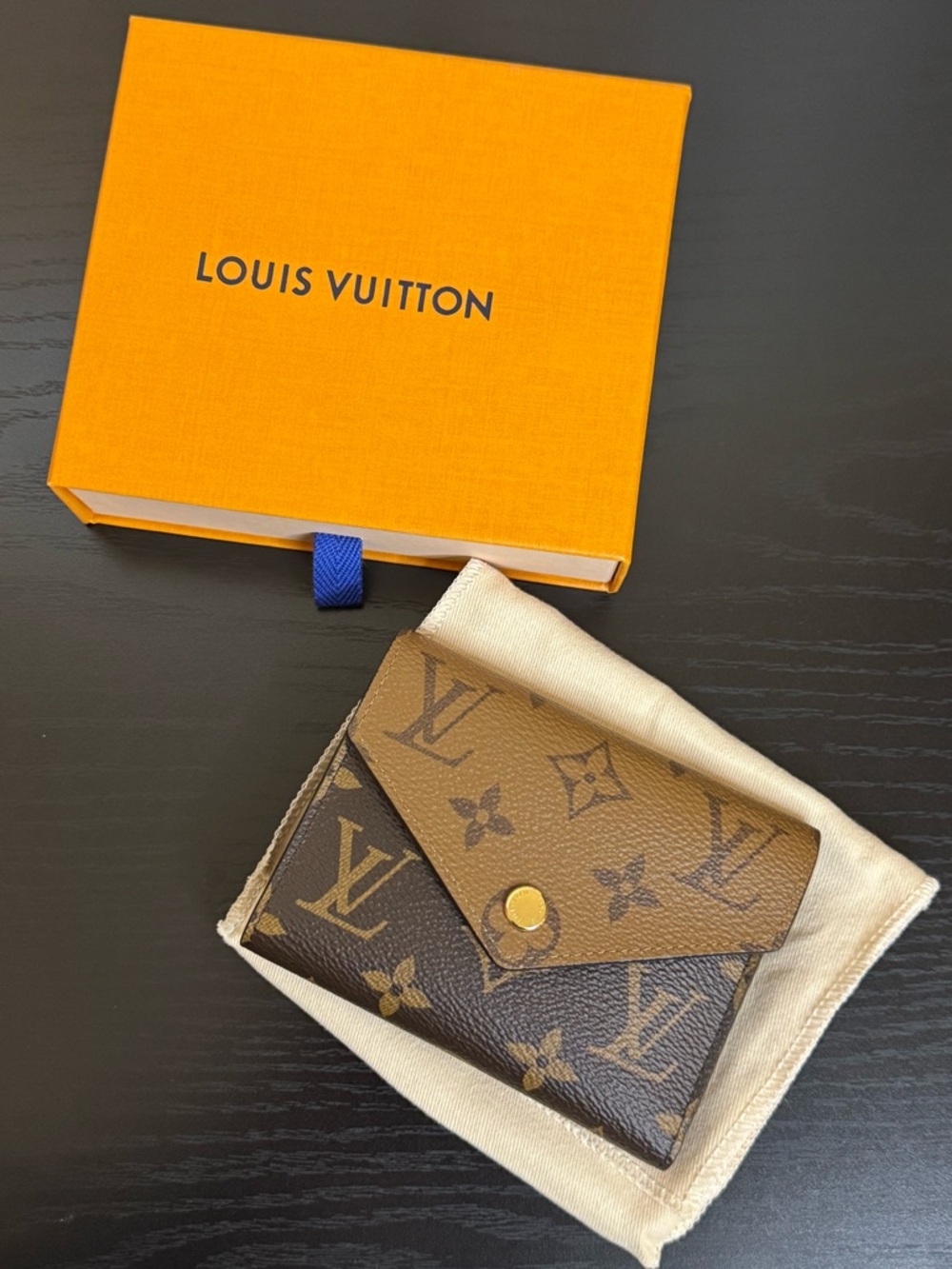 Louis Vuitton Victorine wallet in reverse monogram pattern
